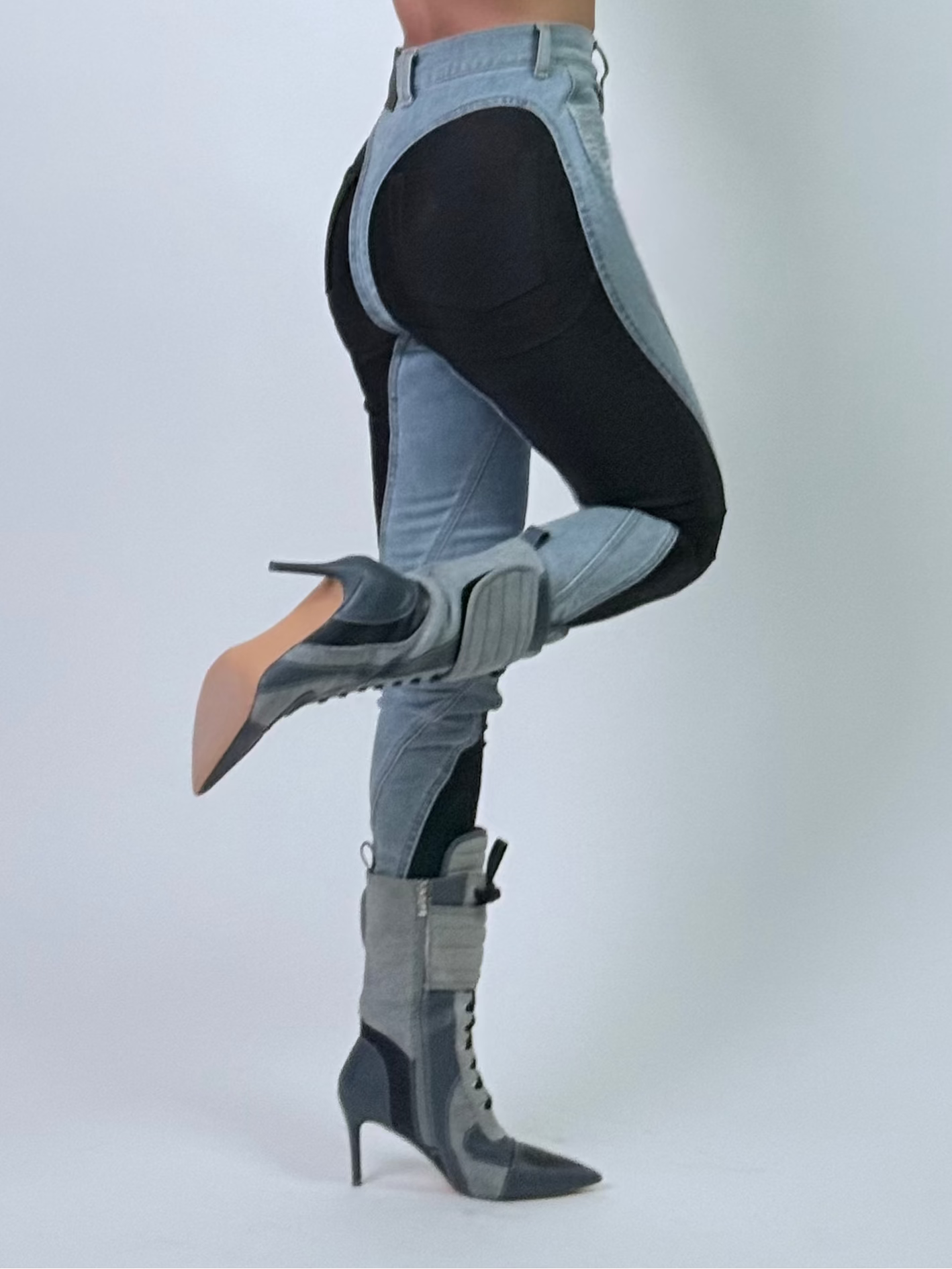 Person posing in a studio with a white backdrop